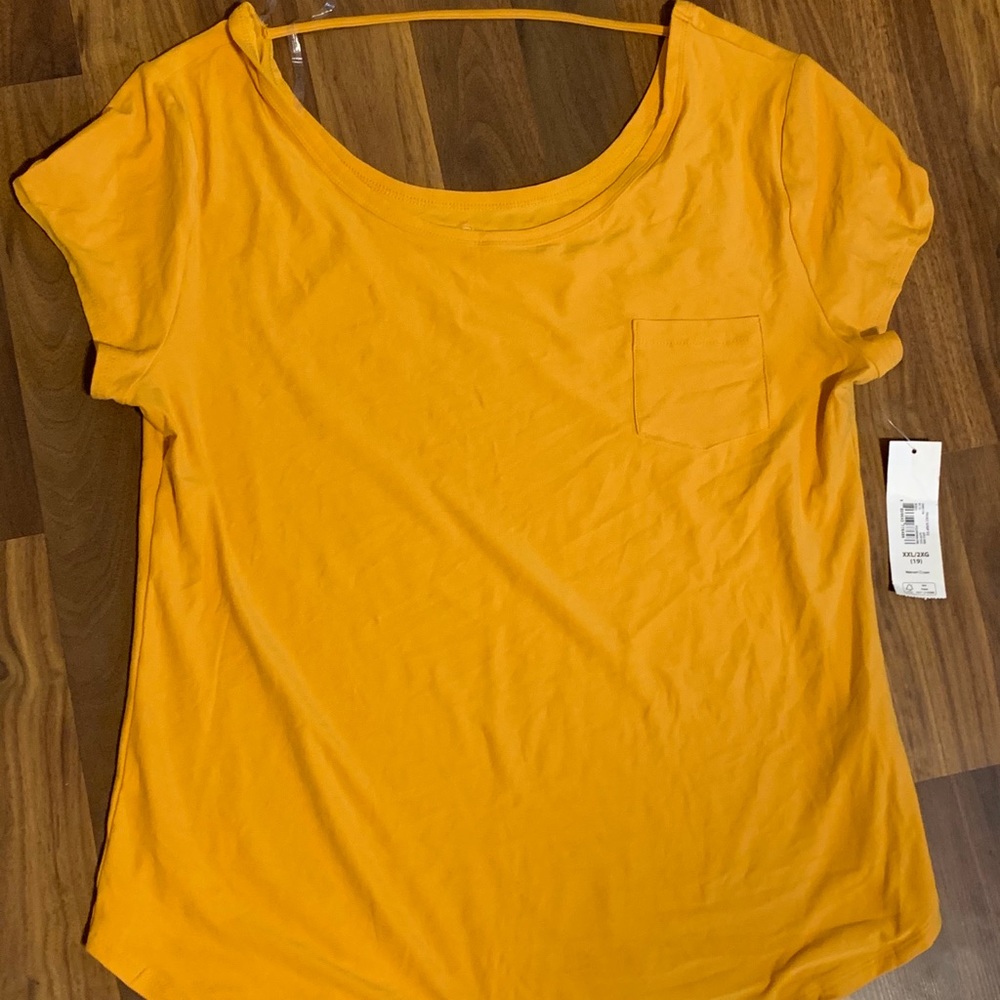 Mustard colored shirt.